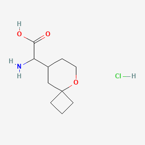 molecular formula C10H18ClNO3 B1378791 2-氨基-2-{5-氧杂螺[3.5]壬烷-8-基}乙酸盐酸盐 CAS No. 1607249-39-7