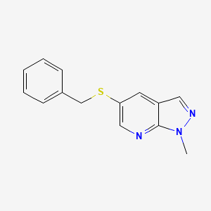 molecular formula C14H13N3S B1379215 5-(benzylsulfanyl)-1-methyl-1H-pyrazolo[3,4-b]pyridine CAS No. 1803572-30-6