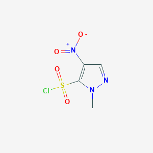 molecular formula C4H4ClN3O4S B1379325 1-甲基-4-硝基-1H-吡唑-5-磺酰氯 CAS No. 1365941-03-2