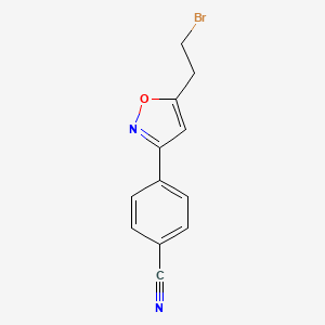 molecular formula C12H9BrN2O B1379853 4-[5-(2-bromoethyl)-3-isoxazolyl]Benzonitrile CAS No. 1199773-86-8