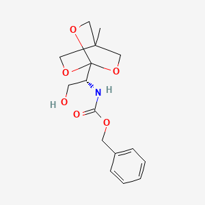 molecular formula C16H21NO6 B13798832 1-[N-Benzyloxycarbonyl-(1R)-1-amino-2-hydroxyethyl]-4-methyl-2,6,7-trioxabicyclo[2.2.2]octane 