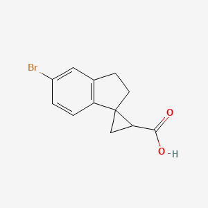 molecular formula C12H11BrO2 B1380332 5'-溴-2',3'-二氢螺[环丙烷-1,1'-茚满]-3-羧酸 CAS No. 1499315-74-0