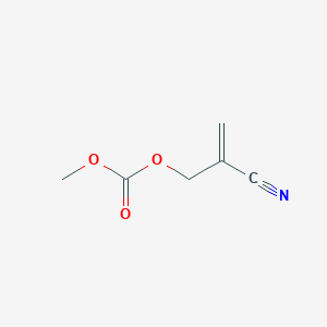 molecular formula C6H7NO3 B1381452 2-{[(Methoxycarbonyl)oxy]methyl}prop-2-enenitrile CAS No. 1803570-03-7