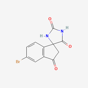 molecular formula C11H7BrN2O3 B1381844 5'-溴代螺[咪唑烷-4,1'-[1H]茚满]-2,3',5(2'H)-三酮 CAS No. 1889290-24-7