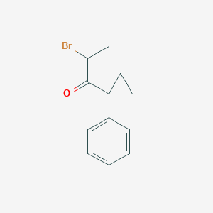 molecular formula C12H13BrO B1382351 2-Bromo-1-(1-phenylcyclopropyl)propan-1-one CAS No. 1803604-17-2