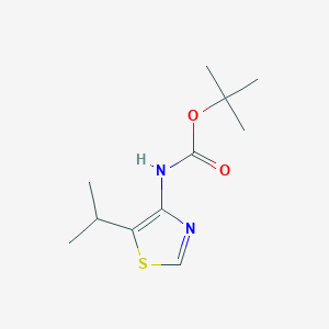 molecular formula C11H18N2O2S B1382390 tert-butyl N-[5-(propan-2-yl)-1,3-thiazol-4-yl]carbamate CAS No. 1803608-32-3