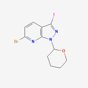 molecular formula C11H11BrIN3O B1382599 6-Bromo-3-iodo-1-(tetrahydro-2H-pyran-2-yl)-1H-pyrazolo[3,4-b]pyridine CAS No. 1416712-53-2