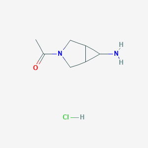 molecular formula C7H13ClN2O B1382618 1-(6-Amino-3-azabicyclo[3.1.0]hexan-3-yl)ethan-1-one hydrochloride CAS No. 1989672-41-4