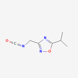 molecular formula C7H9N3O2 B13837526 3-(Isocyanatomethyl)-5-propan-2-yl-1,2,4-oxadiazole 