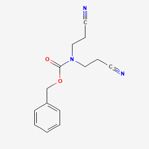 molecular formula C14H15N3O2 B1383916 Benzyl bis(2-cyanoethyl)carbamate CAS No. 1876646-71-7