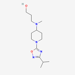 molecular formula C14H26N4O2 B13843190 3-[Methyl-[1-(3-propan-2-yl-1,2,4-oxadiazol-5-yl)piperidin-4-yl]amino]propan-1-ol 