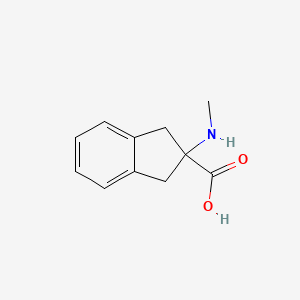 2-(Methylamino)-1,3-dihydroindene-2-carboxylic acid