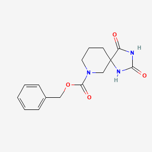 molecular formula C15H17N3O4 B13900999 Benzyl 2,4-dioxo-1,3,7-triazaspiro[4.5]decane-7-carboxylate 