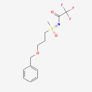 molecular formula C13H16F3NO3S B13901158 2,2,2-trifluoro-N-[methyl-oxo-(3-phenylmethoxypropyl)-lambda6-sulfanylidene]acetamide 