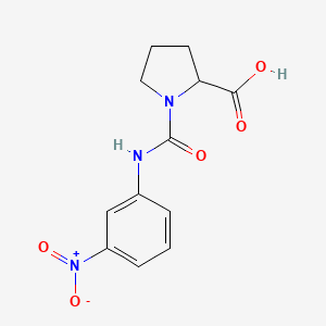 B1390926 1-{[(3-Nitrophenyl)amino]carbonyl}proline CAS No. 1132651-06-9