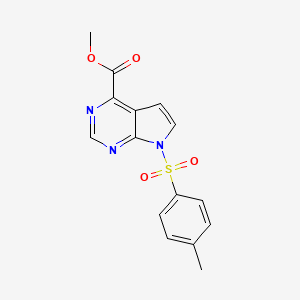 molecular formula C15H13N3O4S B1392913 Methyl 7-tosyl-7H-pyrrolo[2,3-d]pyrimidine-4-carboxylate CAS No. 1261365-63-2