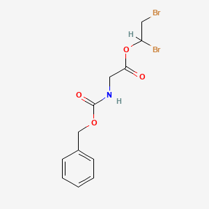 molecular formula C12H13Br2NO4 B13940021 N-Carbobenzoxyglycine 1,2-dibromoethyl ester CAS No. 64187-25-3