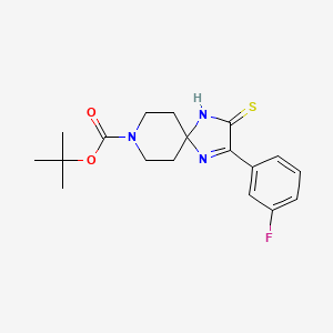 molecular formula C18H22FN3O2S B1394466 叔丁基 2-(3-氟苯基)-3-硫代亚甲基-1,4,8-三氮杂螺[4.5]癸-1-烯-8-羧酸酯 CAS No. 1325303-52-3