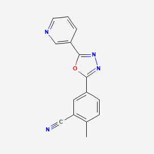 molecular formula C15H10N4O B13947553 2-Methyl-5-(5-pyridin-3-yl-[1,3,4]oxadiazol-2-yl)-benzonitrile 