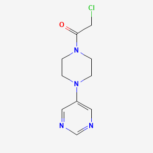 molecular formula C10H13ClN4O B1396381 5-[4-(Chloroacetyl)piperazin-1-yl]pyrimidine CAS No. 1306739-48-9
