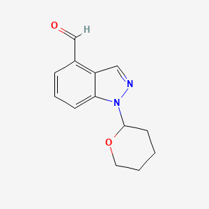 molecular formula C13H14N2O2 B1398880 1-(Tetrahydro-2H-pyran-2-YL)-1H-indazole-4-carbaldehyde CAS No. 1022158-36-6