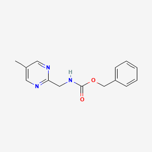 Phenylmethyl N-[(5-methyl-2-pyrimidinyl)methyl]carbamate