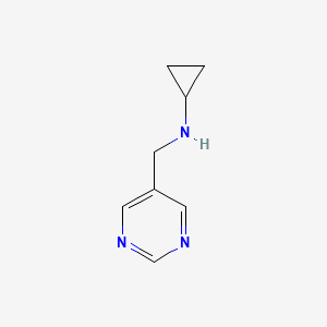 molecular formula C8H11N3 B1399701 N-[(pyrimidin-5-yl)methyl]cyclopropanamine CAS No. 1405774-24-4