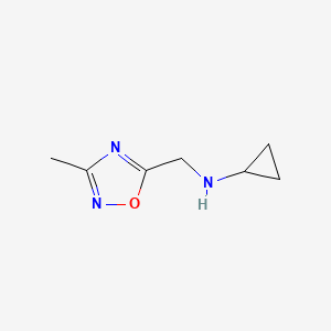 molecular formula C7H11N3O B1400684 N-[(3-methyl-1,2,4-oxadiazol-5-yl)methyl]cyclopropanamine CAS No. 1179634-23-1