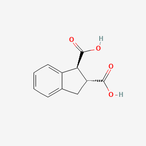 molecular formula C11H10O4 B14013839 trans-Indane-1,2-dicarboxylic acid 