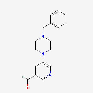 B1402066 5-(4-Benzylpiperazin-1-yl)nicotinaldehyde CAS No. 1779121-89-9