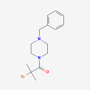 1-Benzyl-4-(2-bromo-2-methylpropanoyl)piperazine