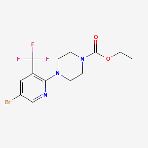 molecular formula C13H15BrF3N3O2 B1405307 4-(5-Bromo-3-trifluoromethyl-pyridin-2-yl)-piperazine-1-carboxylic acid ethyl ester CAS No. 1401522-00-6