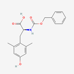 molecular formula C19H21NO5 B14055109 (S)-2-(((Benzyloxy)carbonyl)amino)-3-(4-hydroxy-2,6-dimethylphenyl)propanoic acid 