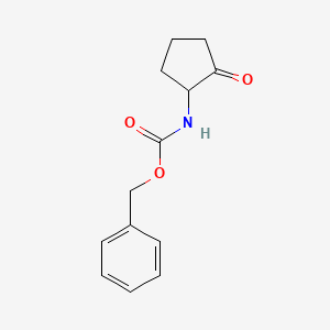 molecular formula C13H15NO3 B1405892 苯甲酸苄酯（2-氧代环戊基）酯 CAS No. 1391090-10-0