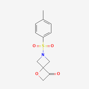 molecular formula C12H13NO4S B1408502 6-トシル-1-オキサ-6-アザスピロ[3.3]ヘプタン-3-オン CAS No. 1349199-62-7