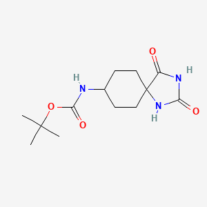 molecular formula C13H21N3O4 B1408740 tert-Butyl (2,4-dioxo-1,3-diazaspiro[4.5]decan-8-yl)carbamate CAS No. 1187020-26-3