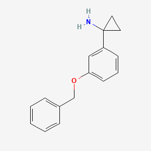 molecular formula C16H17NO B1409057 1-[3-(Benzyloxy)phenyl]cyclopropan-1-amine CAS No. 1314761-52-8