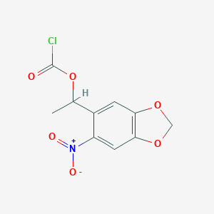 molecular formula C10H8ClNO6 B141395 1-(6-硝基苯并[d][1,3]二氧杂环-5-基)乙基碳酰氯 CAS No. 156876-26-5