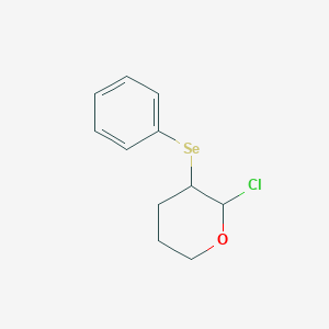 2-Chloro-3-(phenylselanyl)oxane