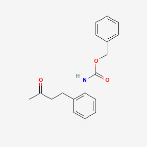 Benzyl [4-methyl-2-(3-oxobutyl)phenyl]carbamate