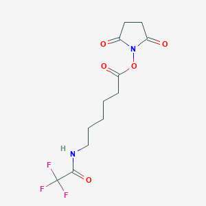 molecular formula C12H15F3N2O5 B014146 2,5-Dioxopyrrolidin-1-YL 6-(2,2,2-trifluoroacetamido)hexanoate CAS No. 117032-51-6