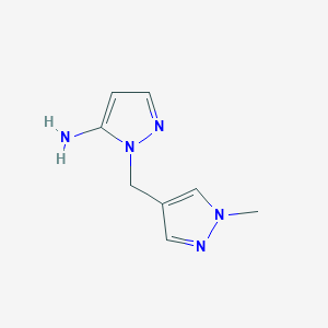 molecular formula C8H11N5 B1416276 1-[(1-methyl-1H-pyrazol-4-yl)methyl]-1H-pyrazol-5-amine CAS No. 1152821-18-5