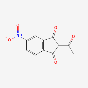 molecular formula C11H7NO5 B14171718 2-Acetyl-5-nitroindan-1,3-dione CAS No. 25125-05-7