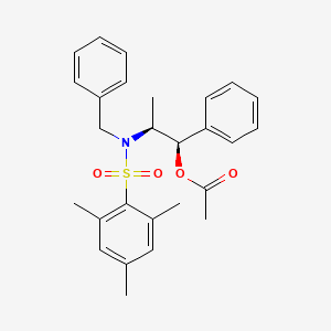 B1417930 (1R,2S)-2-[Benzyl(2,4,6-trimethylbenzene-1-sulfonyl)amino]-1-phenylpropyl acetate CAS No. 240423-74-9