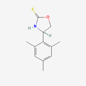 (4R)-4-(2,4,6-trimethylphenyl)-1,3-oxazolidine-2-thione