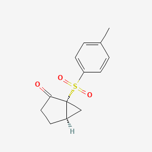 molecular formula C13H14O3S B14188803 (1R,5R)-1-(4-Methylbenzene-1-sulfonyl)bicyclo[3.1.0]hexan-2-one CAS No. 923001-91-6