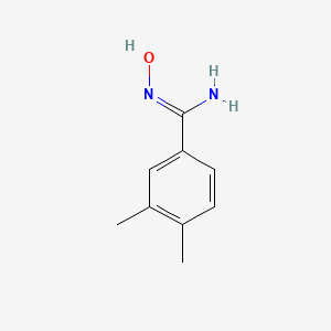 molecular formula C9H12N2O B1419275 (Z)-N'-Hydroxy-3,4-dimethylbenzene-1-carboximidamide CAS No. 40312-15-0