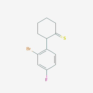 2-(2-Bromo-4-fluorophenyl)cyclohexane-1-thione