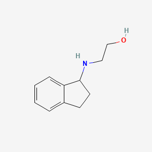 B1419982 2-[(2,3-dihydro-1H-inden-1-yl)amino]ethan-1-ol CAS No. 99858-65-8