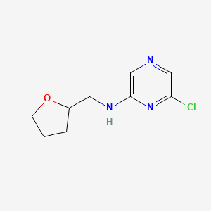 molecular formula C9H12ClN3O B1421692 6-氯-N-(氧杂环-2-基甲基)吡嗪-2-胺 CAS No. 1220037-69-3
